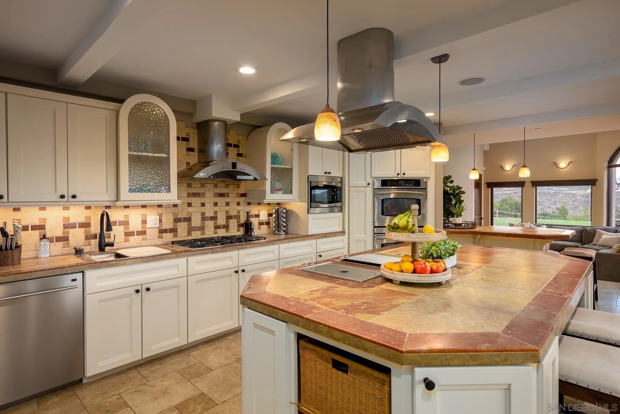 16738 Zumaque Street Rancho Santa Fe, CA 92067 - Photo 20 of 61 a kitchen with a sink a counter space and stainless steel appliances