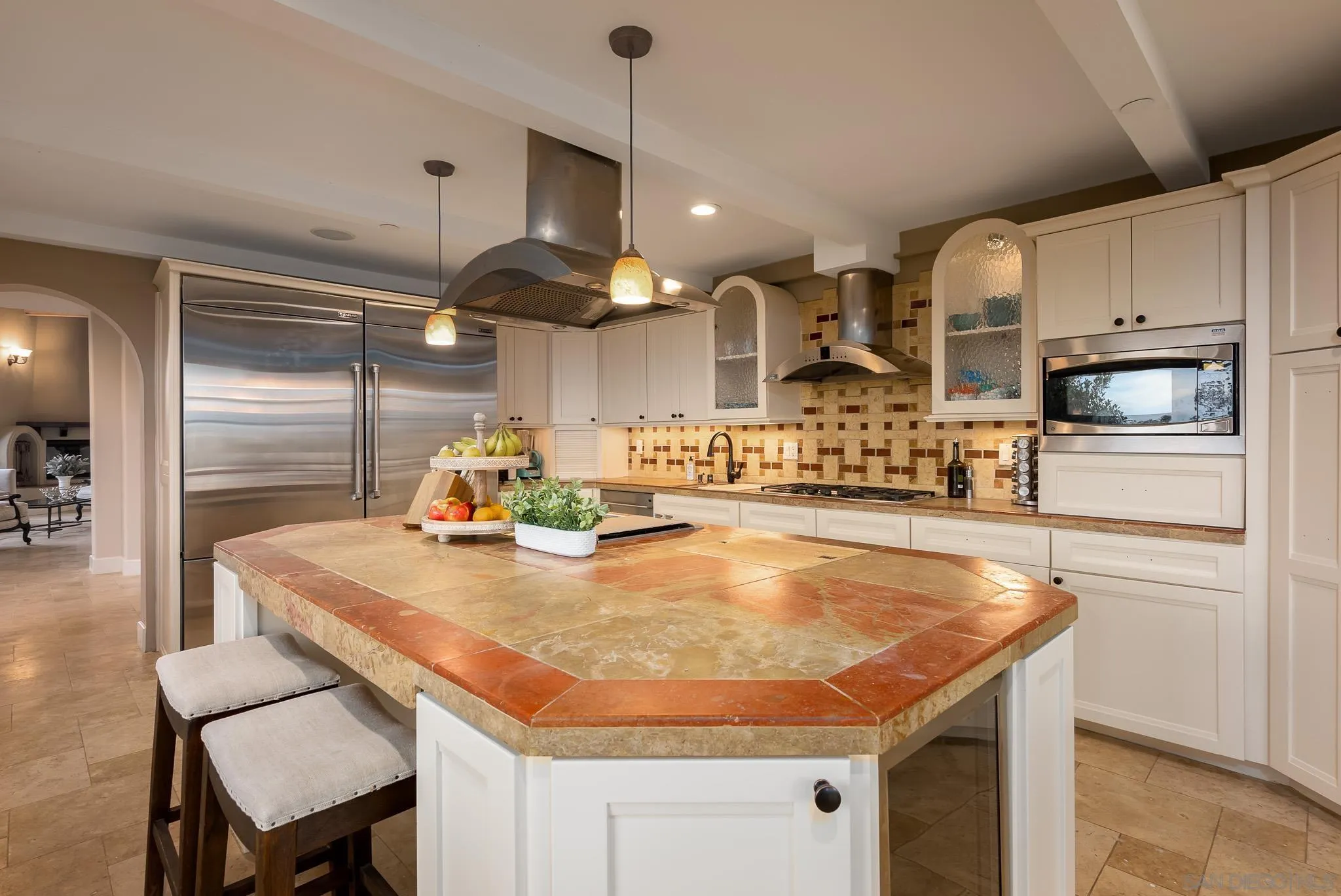 16738 Zumaque Street Rancho Santa Fe, CA 92067 - Photo 21 of 61 a kitchen with stainless steel appliances granite countertop a sink a stove and a refrigerator