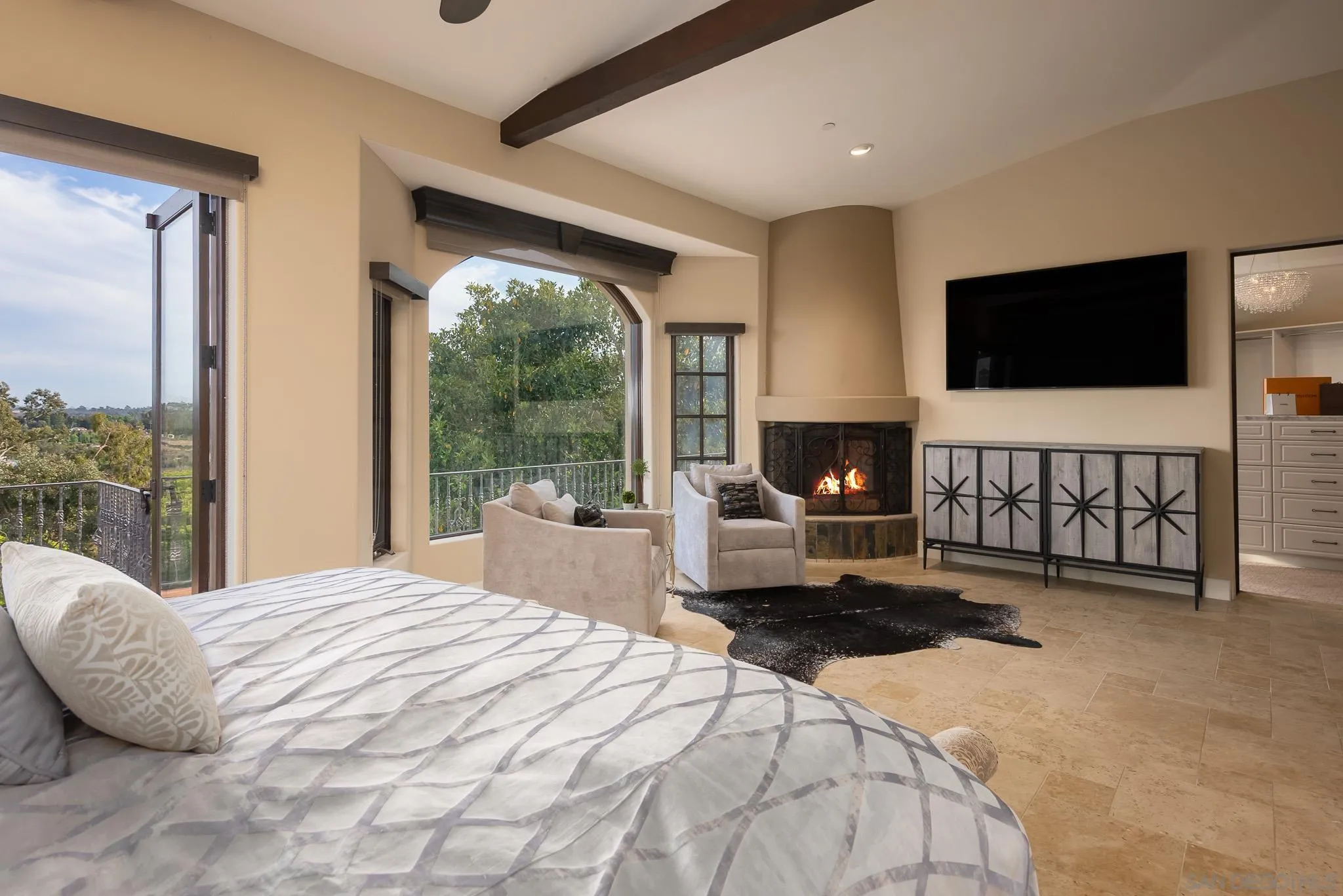 16738 Zumaque Street Rancho Santa Fe, CA 92067 - Photo 27 of 61 a bedroom with a bed and a flat screen tv