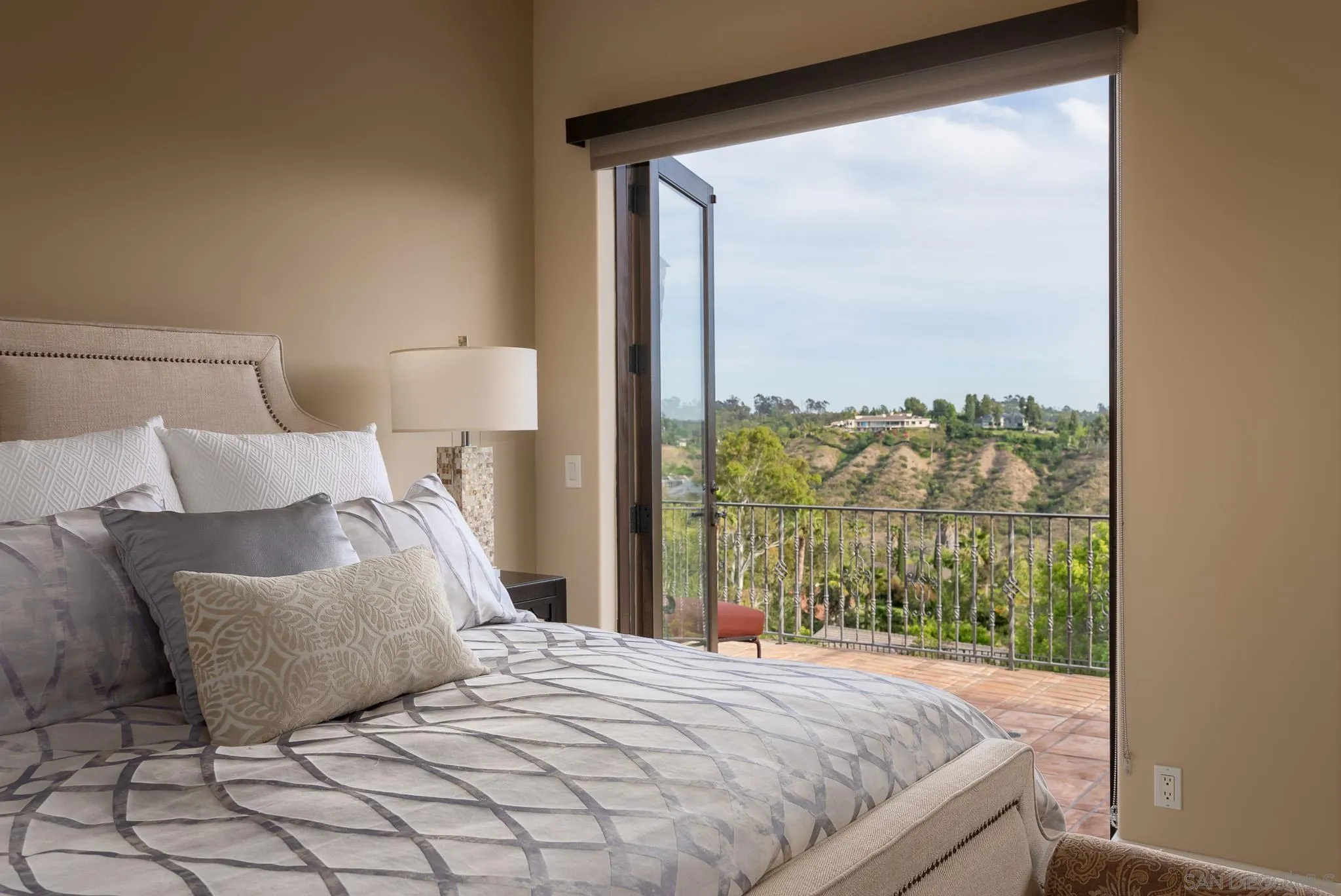 16738 Zumaque Street Rancho Santa Fe, CA 92067 - Photo 28 of 61 a bedroom with a large bed and a window