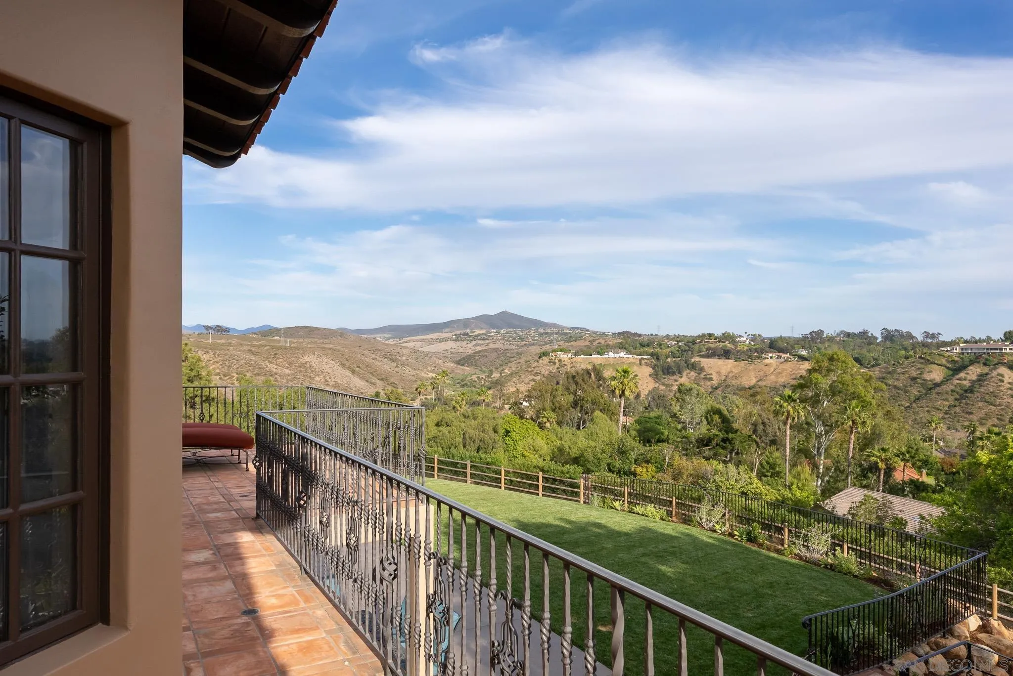 16738 Zumaque Street Rancho Santa Fe, CA 92067 - Photo 30 of 61 a view of a city from a balcony