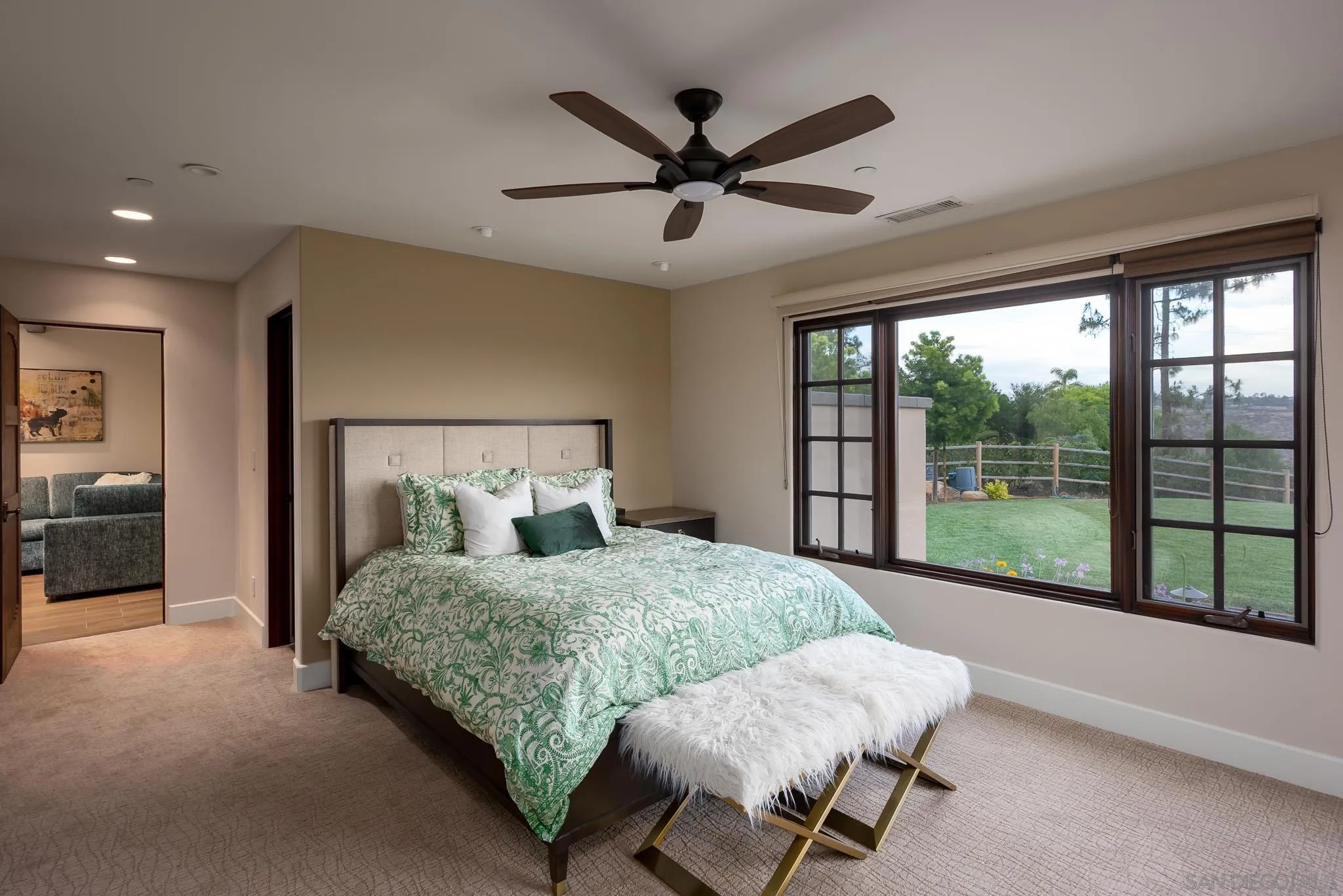 16738 Zumaque Street Rancho Santa Fe, CA 92067 - Photo 35 of 61 a bedroom with a bed and a large window