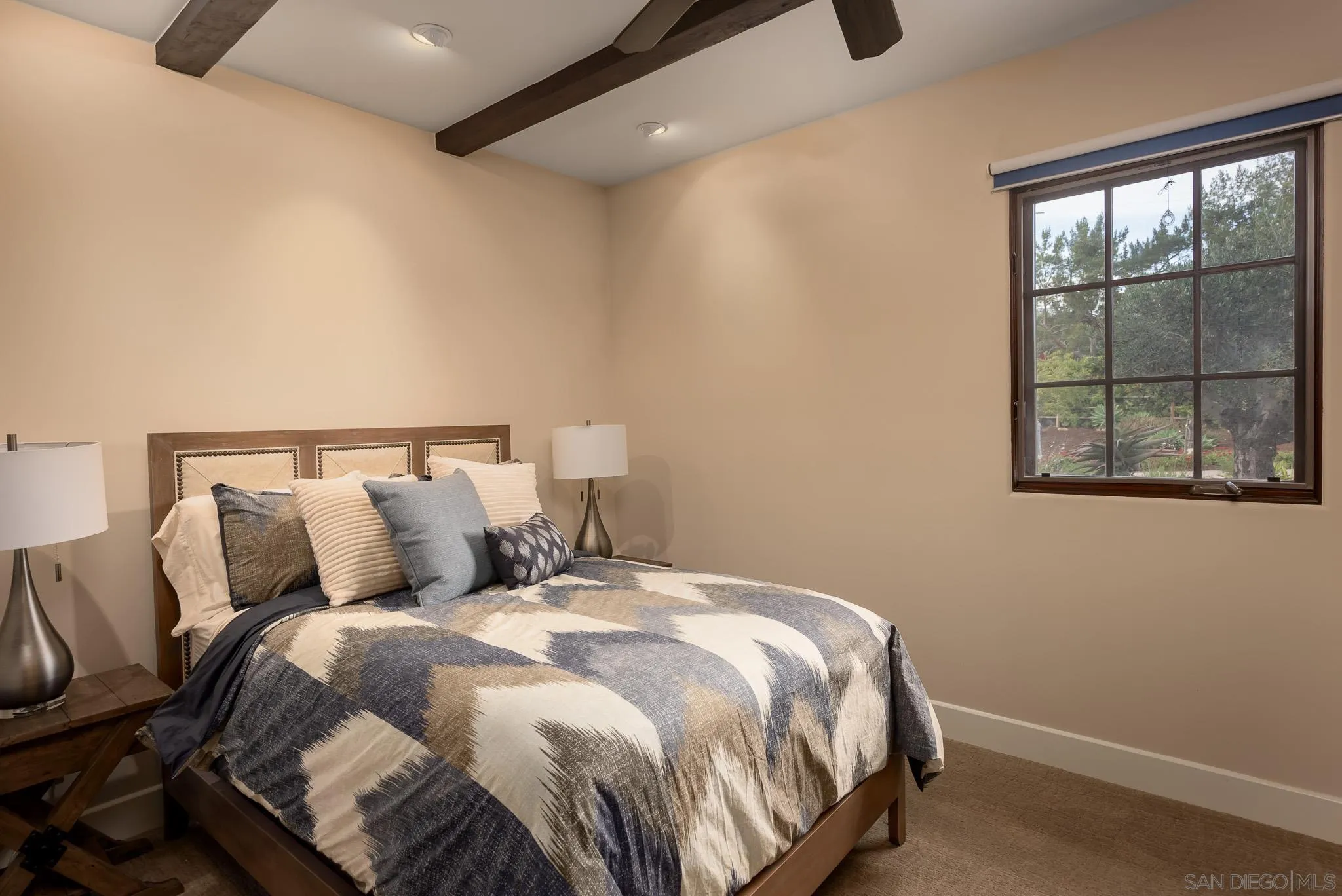 16738 Zumaque Street Rancho Santa Fe, CA 92067 - Photo 36 of 61 a bed sitting in a bedroom next to a window