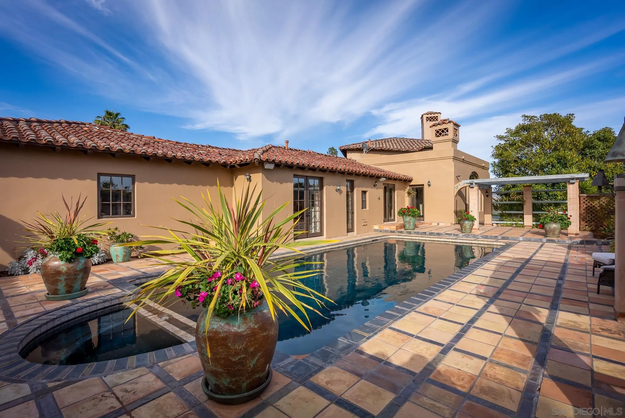 16738 Zumaque Street Rancho Santa Fe, CA 92067 - Photo 40 of 61 a house view with a seating space and potted plants