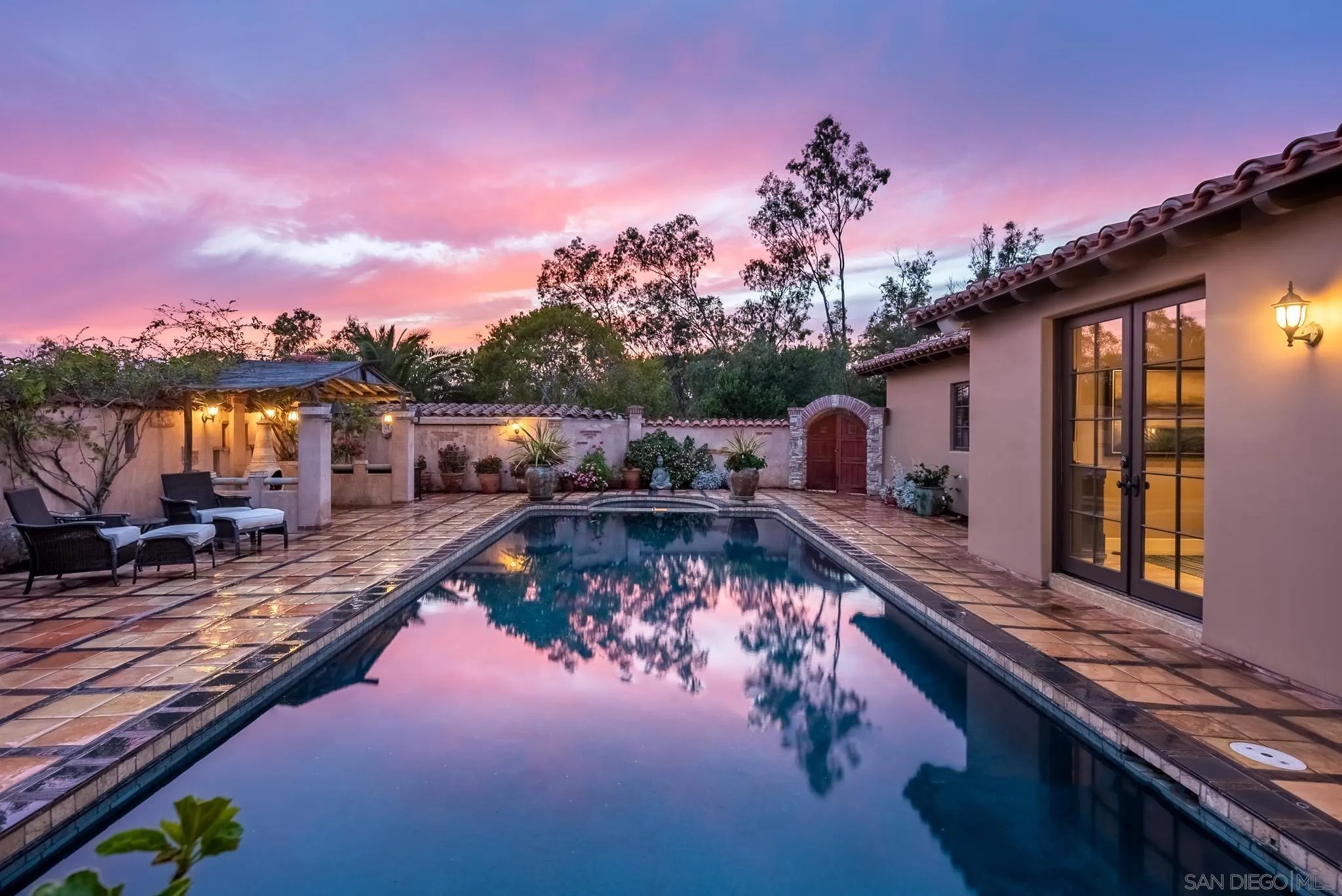 16738 Zumaque Street Rancho Santa Fe, CA 92067 - Photo 43 of 61 a view of a swimming pool with a patio and a yard