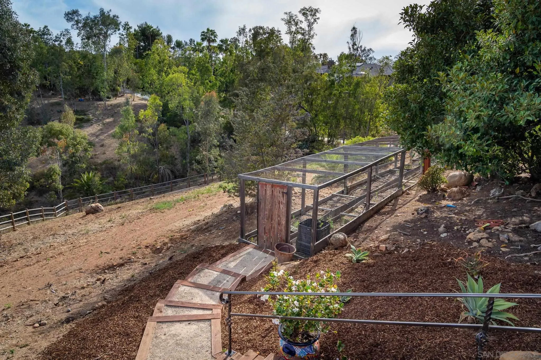 16738 Zumaque Street Rancho Santa Fe, CA 92067 - Photo 51 of 61 a view of a pathway with a yard