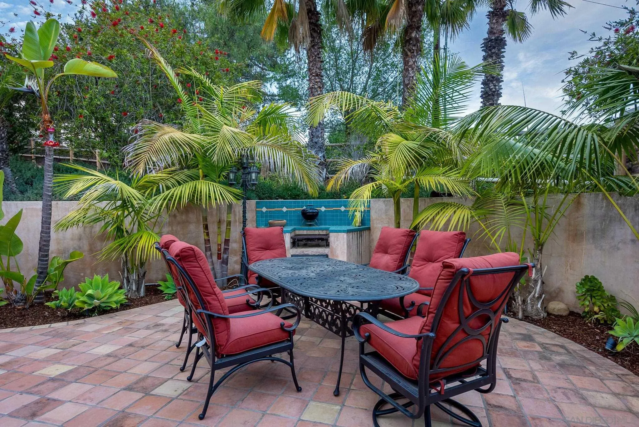 16738 Zumaque Street Rancho Santa Fe, CA 92067 - Photo 55 of 61 a backyard of a house with table and chairs