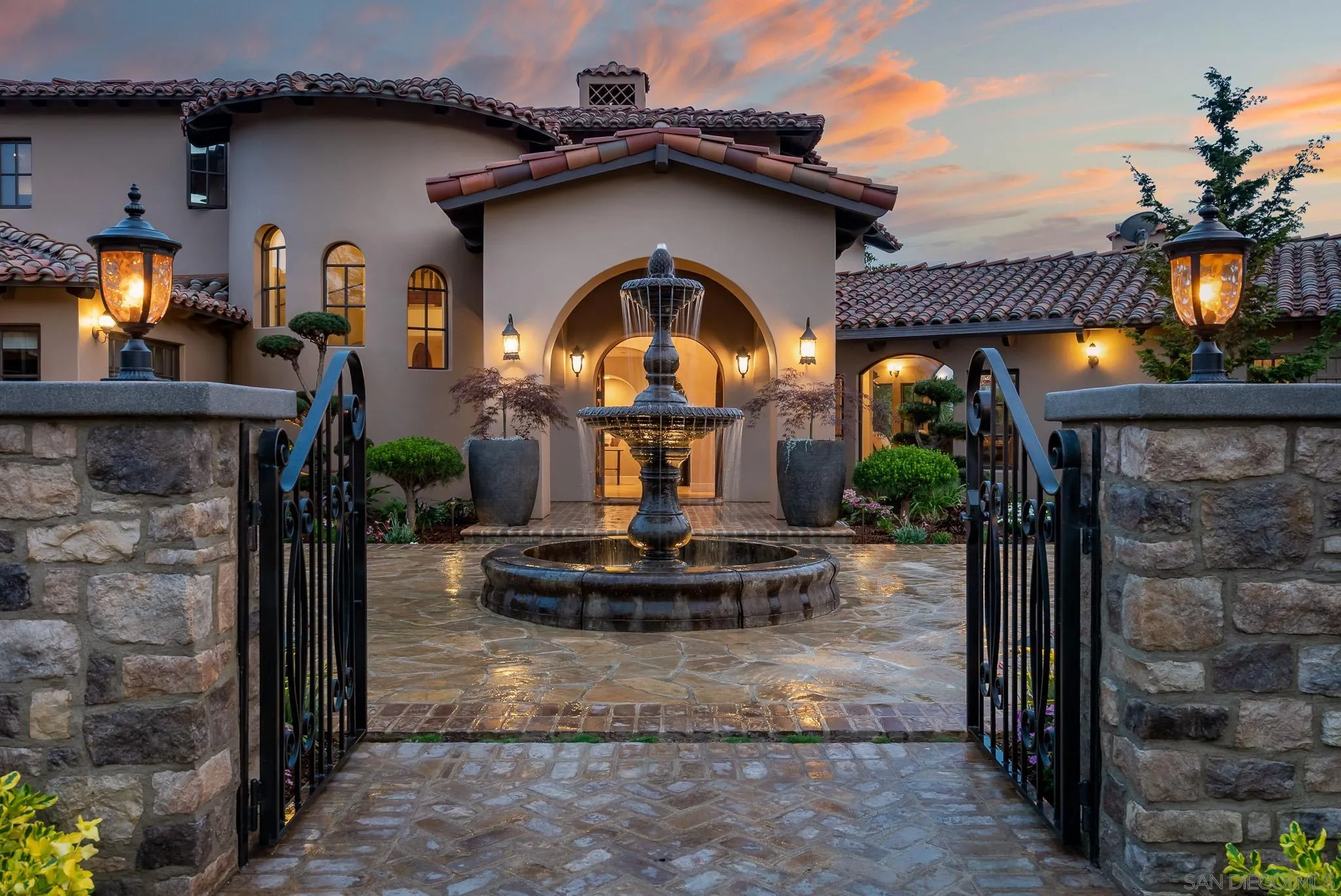 16738 Zumaque Street Rancho Santa Fe, CA 92067 - Photo 7 of 61 a view of a house with fountain and a fireplace