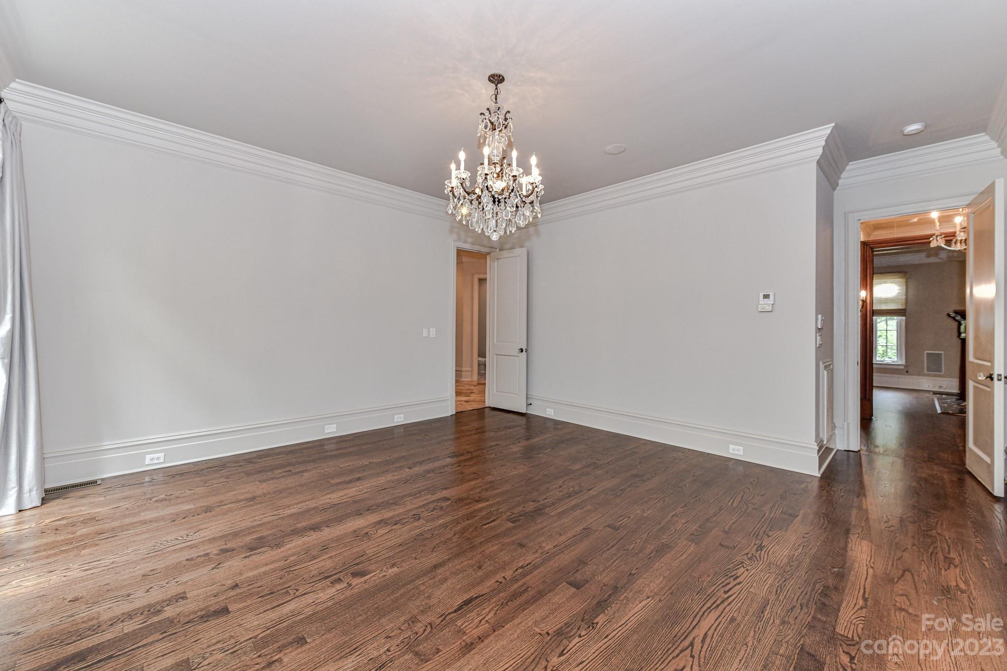 8319 Eagle Glen Charlotte, NC 28210 - Photo 20 of 48 wooden floor in an empty room with a window
