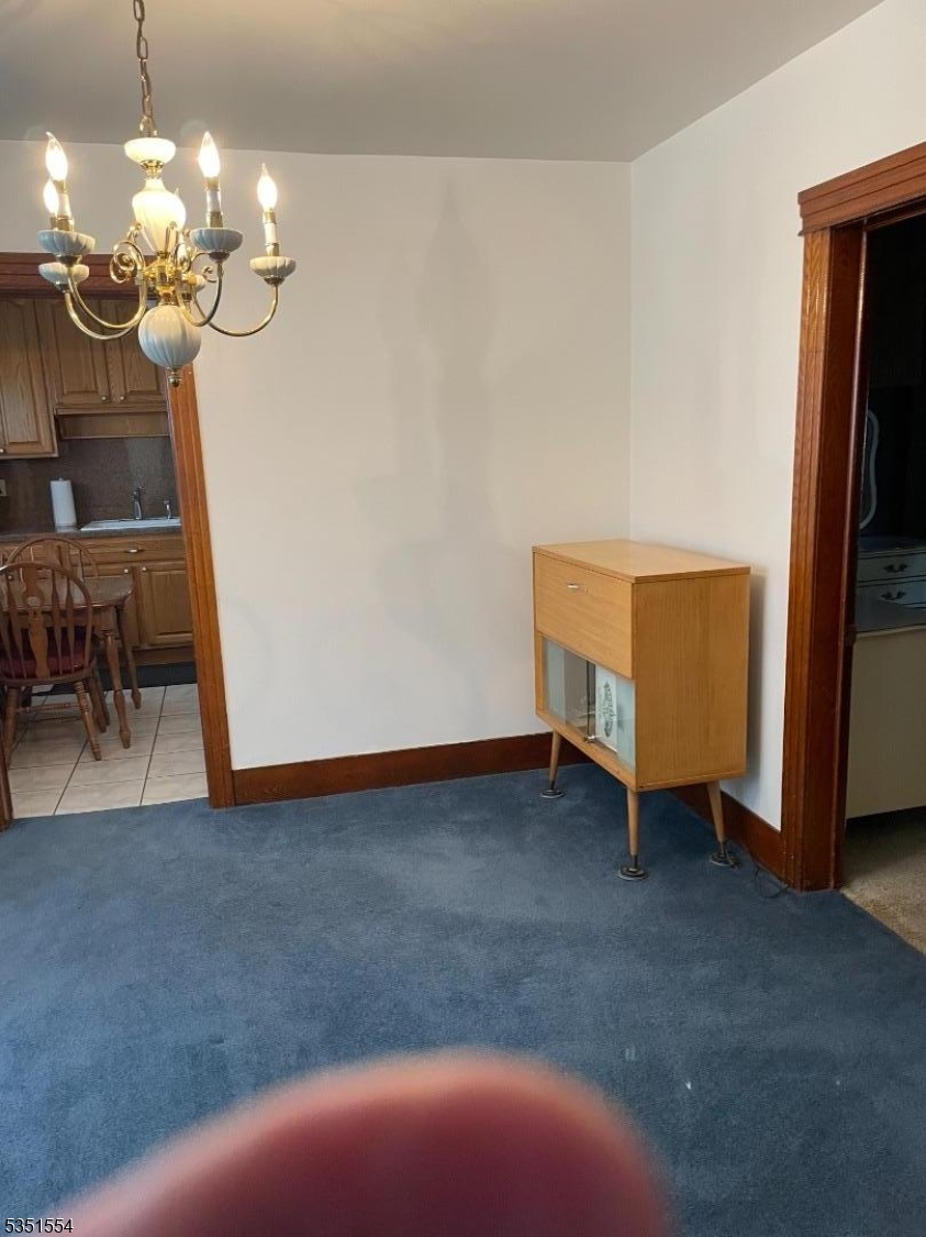 72 Baldwin Place, Unit 2 Bloomfield, NJ 07003 - Photo 5 of 14 a view of livingroom with chandelier