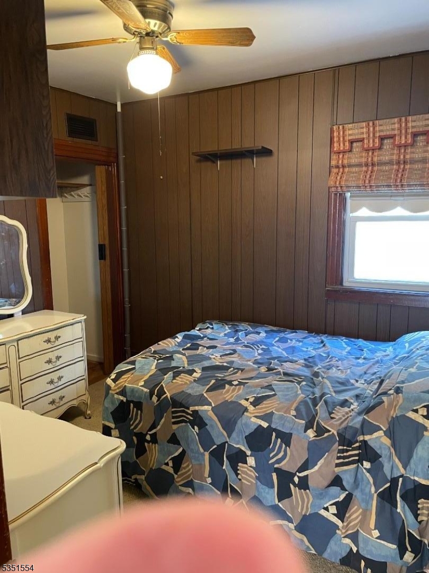 72 Baldwin Place, Unit 2 Bloomfield, NJ 07003 - Photo 8 of 14 a bedroom with a bed and a window