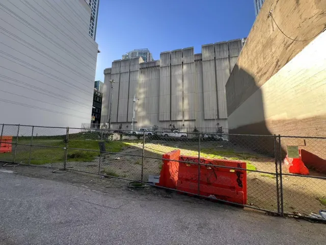 a view of a house with a backyard and sitting area