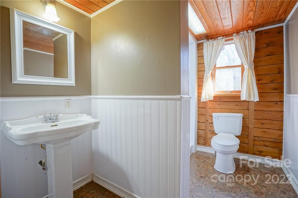 100 Rutledge Road Mount Holly, NC 28120 - Photo 15 of 44 a bathroom with a sink toilet and a mirror