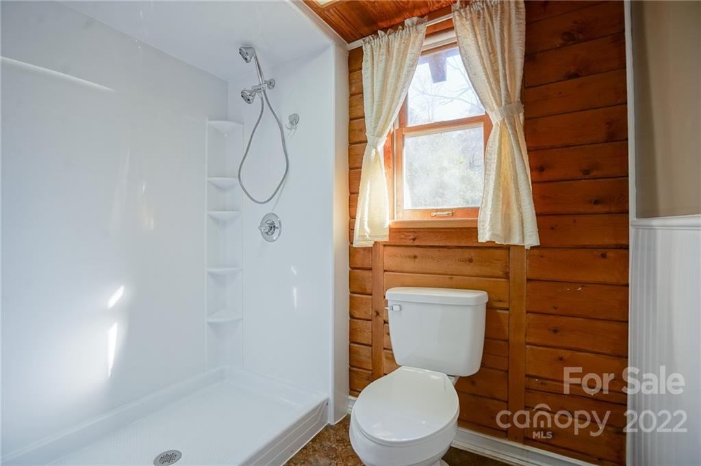 100 Rutledge Road Mount Holly, NC 28120 - Photo 16 of 44 a bathroom with a toilet sink and shower