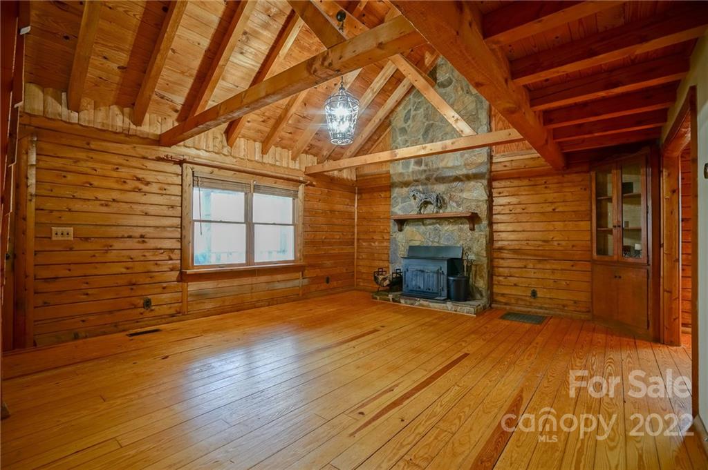 100 Rutledge Road Mount Holly, NC 28120 - Photo 17 of 44 a view of an empty room with wooden floor and a window
