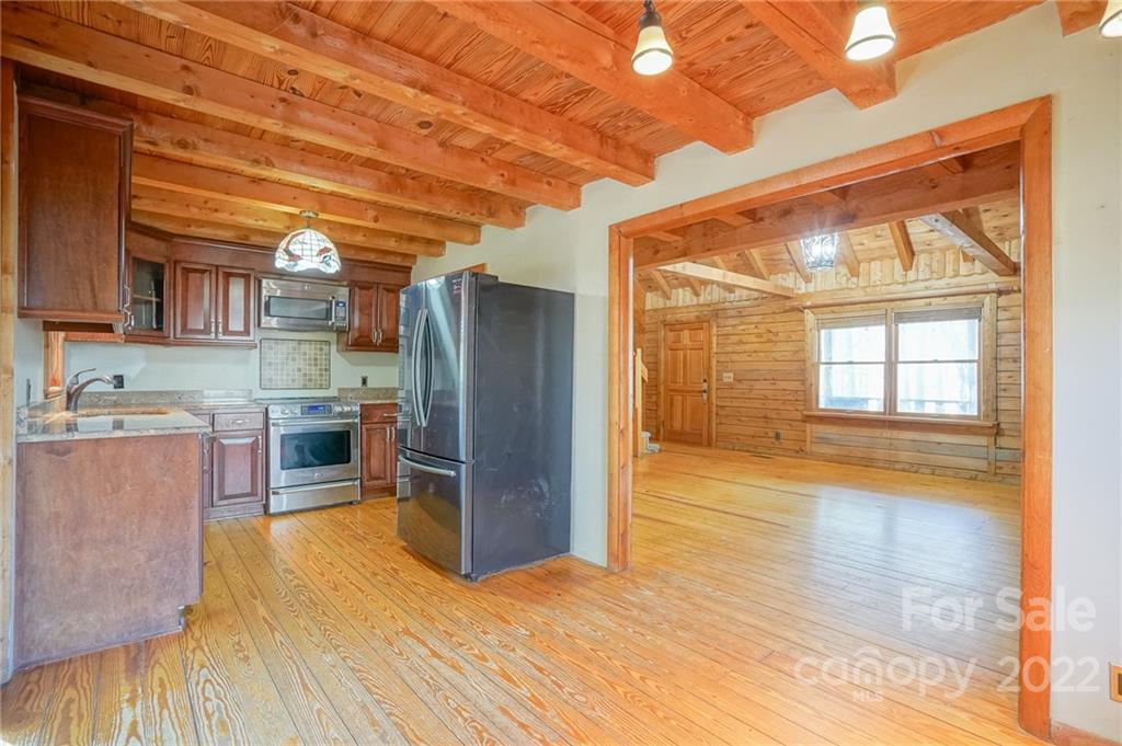 100 Rutledge Road Mount Holly, NC 28120 - Photo 20 of 44 a kitchen with stainless steel appliances a refrigerator and a stove top oven