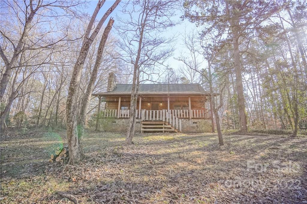 100 Rutledge Road Mount Holly, NC 28120 - Photo 3 of 44 a front view of a house with a yard