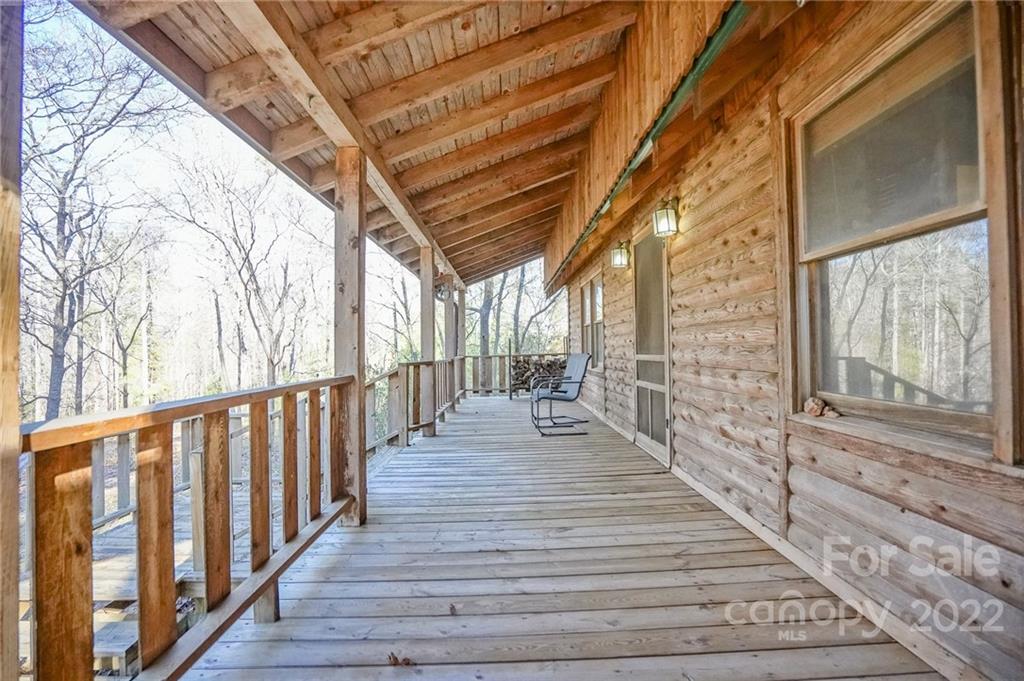 100 Rutledge Road Mount Holly, NC 28120 - Photo 8 of 44 a view of a porch with wooden floor and stairs