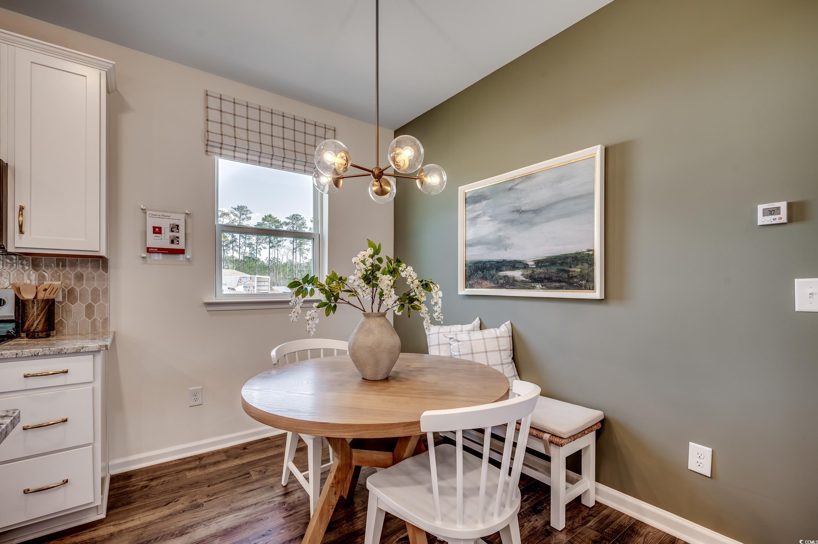 5009 Gallop Court Myrtle Beach, SC 29588 - Photo 8 of 14 Dining area with dark wood-style floors and a chandelier