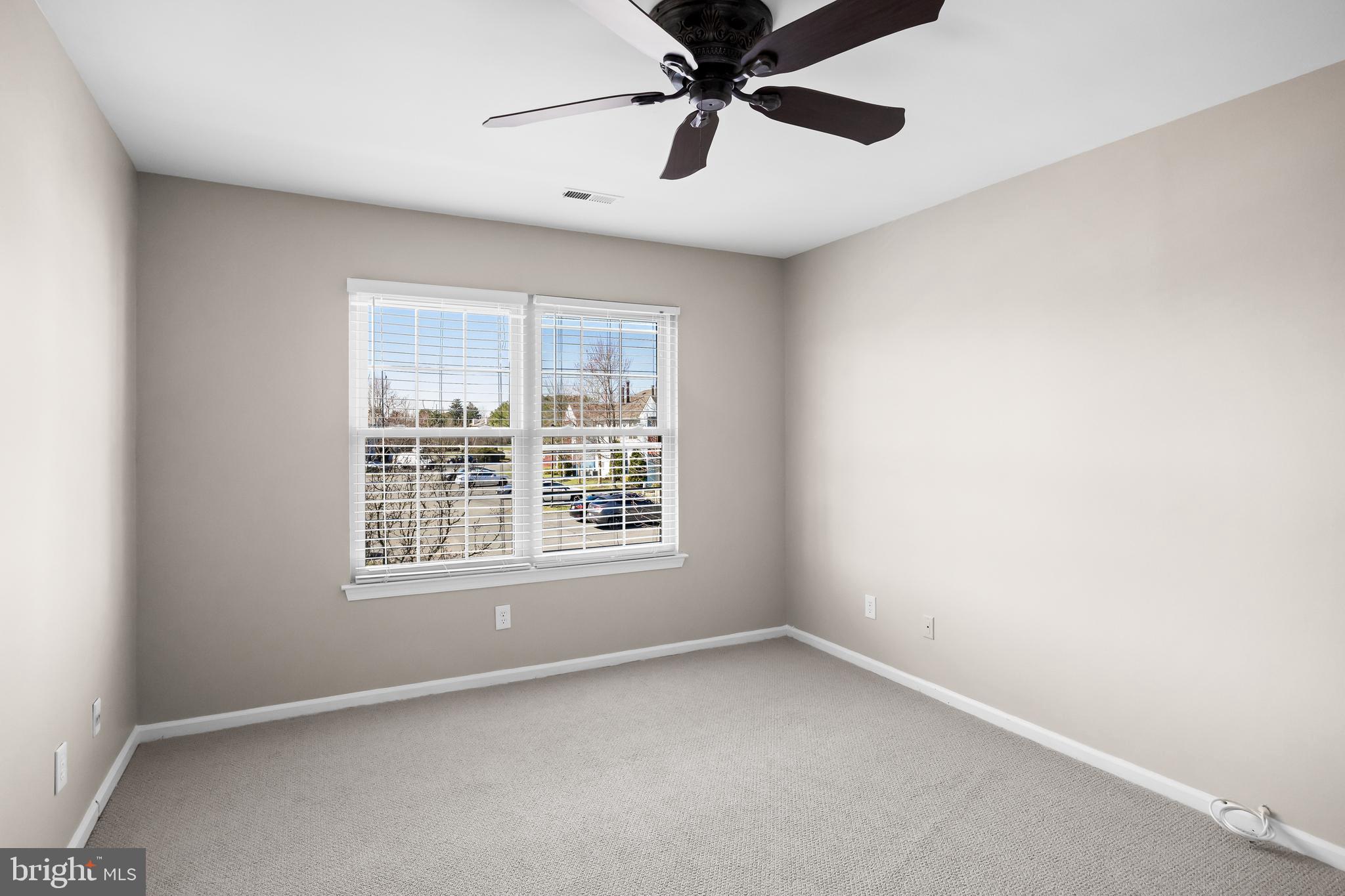 620 Covington Court Sewell, NJ 08080 - Photo 18 of 26 an empty room with a window and a fan