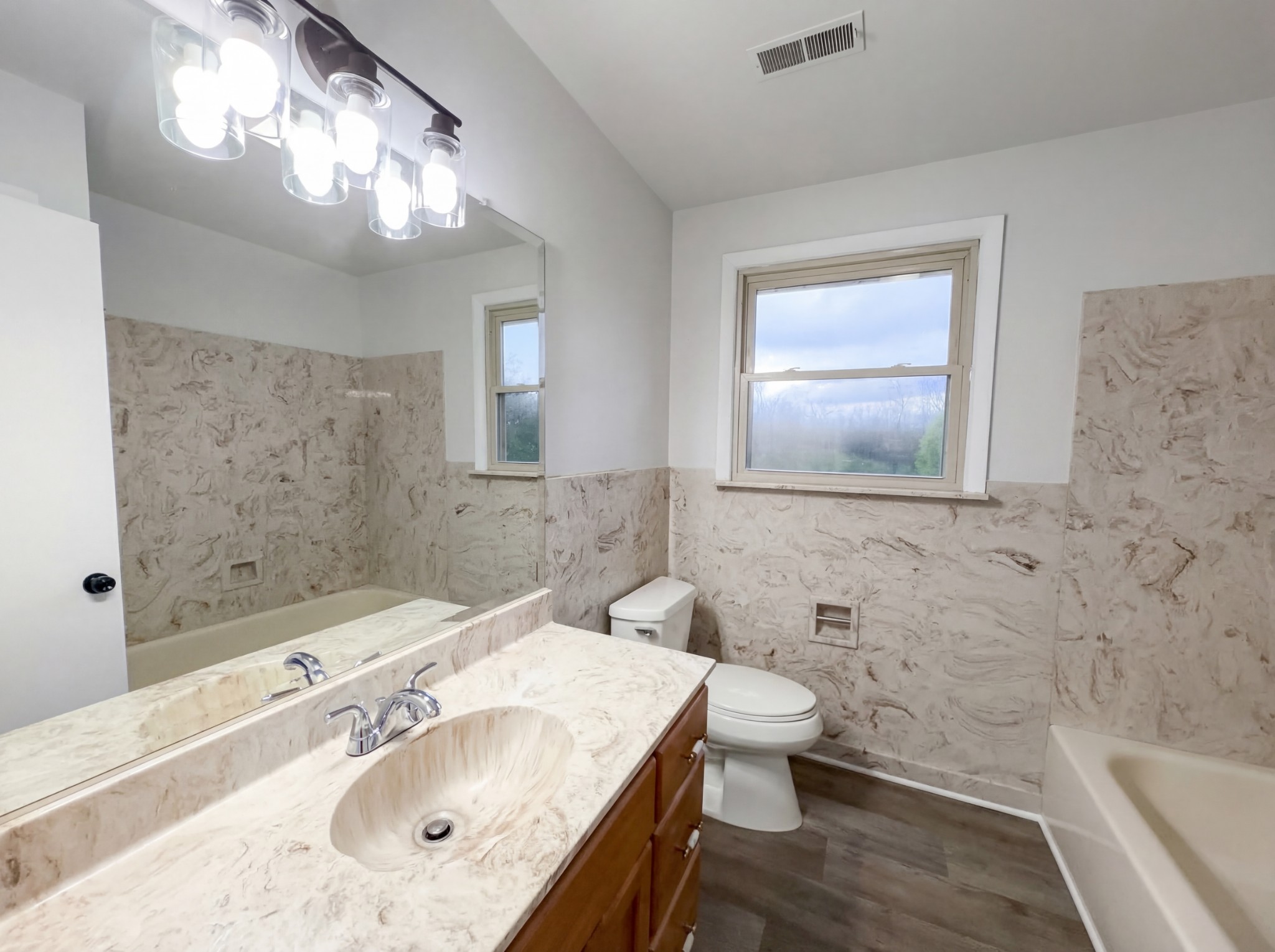 823 Apple Valley Road Madison, TN 37115 - Photo 13 of 23 a bathroom with a sink a toilet and shower