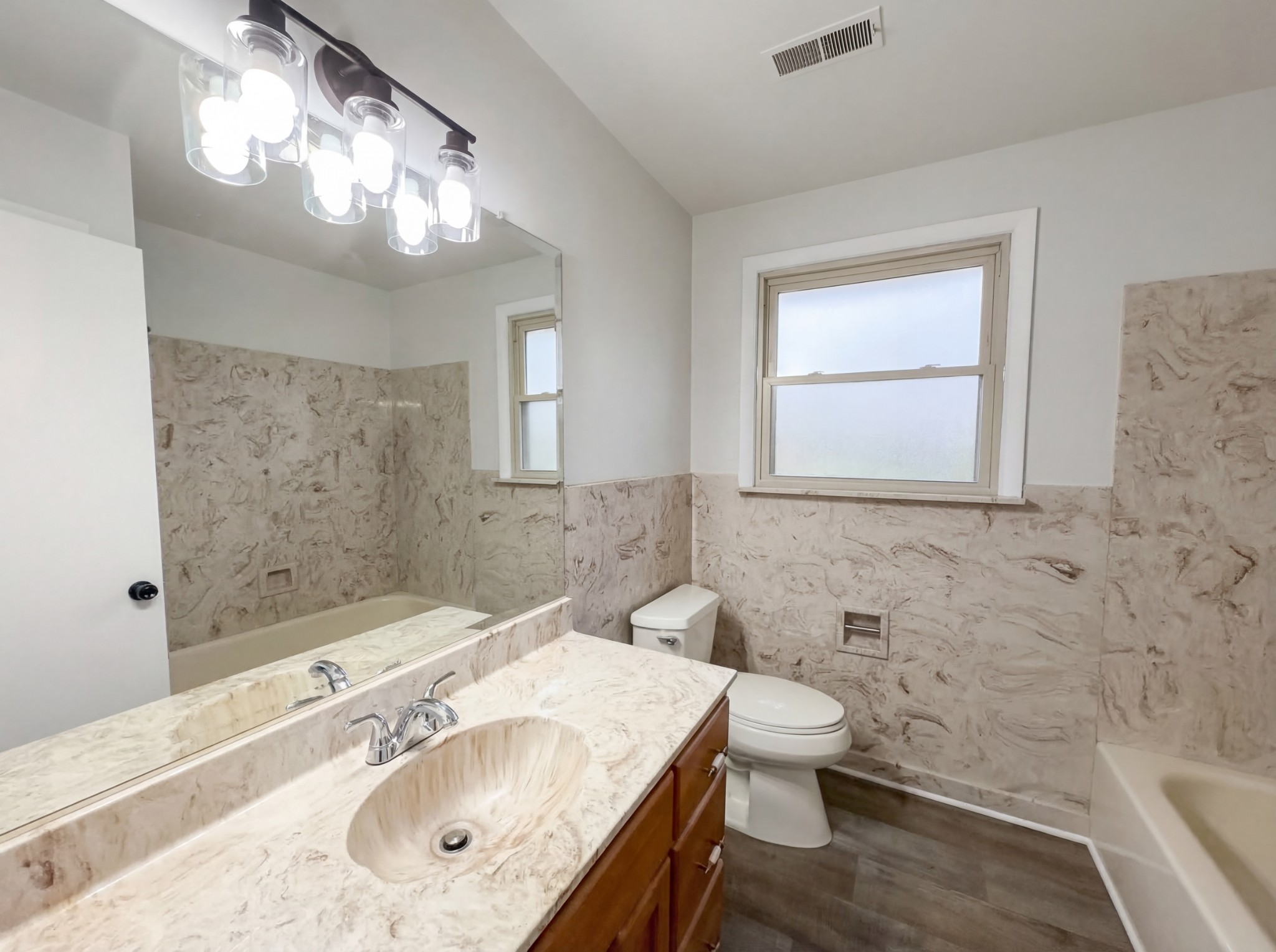823 Apple Valley Road Madison, TN 37115 - Photo 6 of 23 a bathroom with a sink a toilet and mirror
