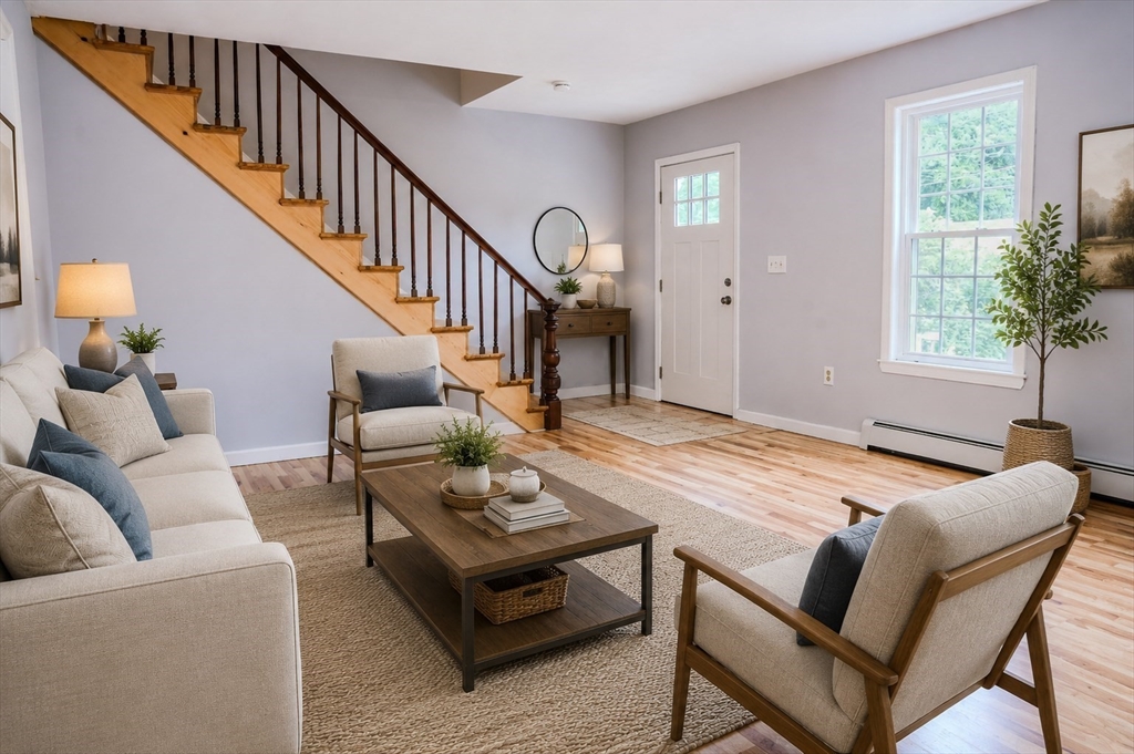 32 Dale Street Franklin, MA 02038 - Photo 2 of 11 a living room with furniture and a potted plant