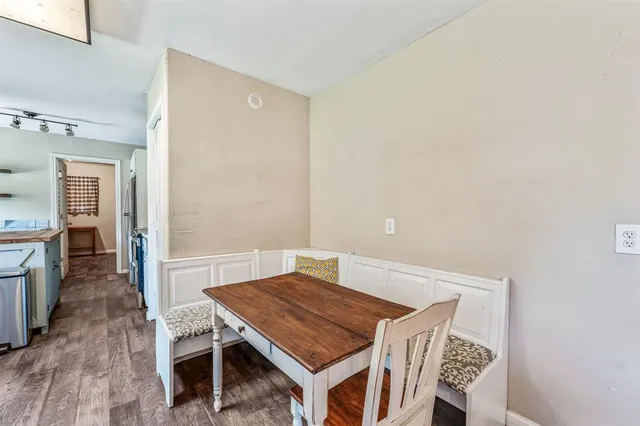 a room with a table and chairs