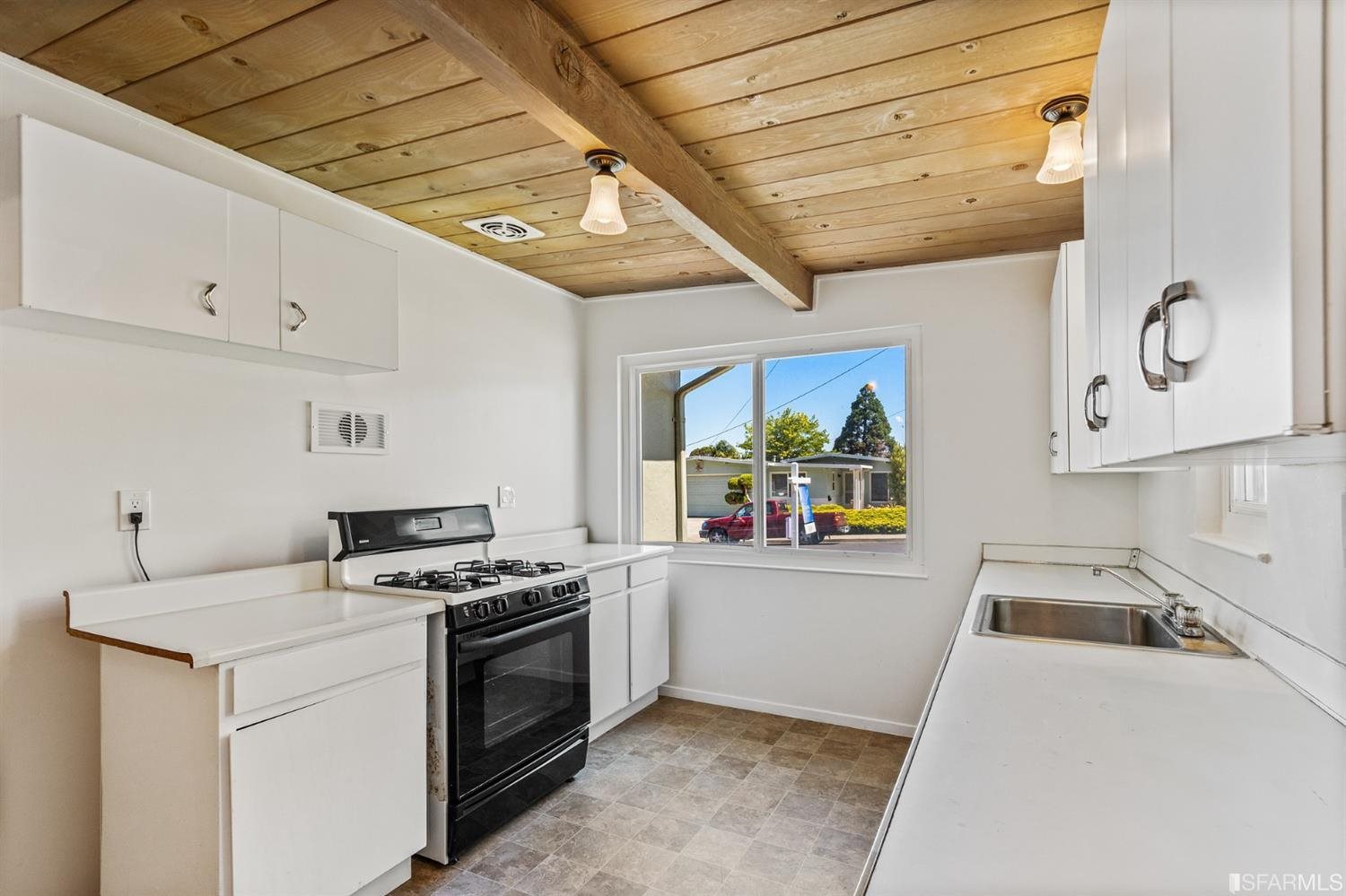 1166 Rising Glen Road Pinole, CA 94564 - Photo 9 of 31 a kitchen with stainless steel appliances granite countertop a sink a stove and cabinets