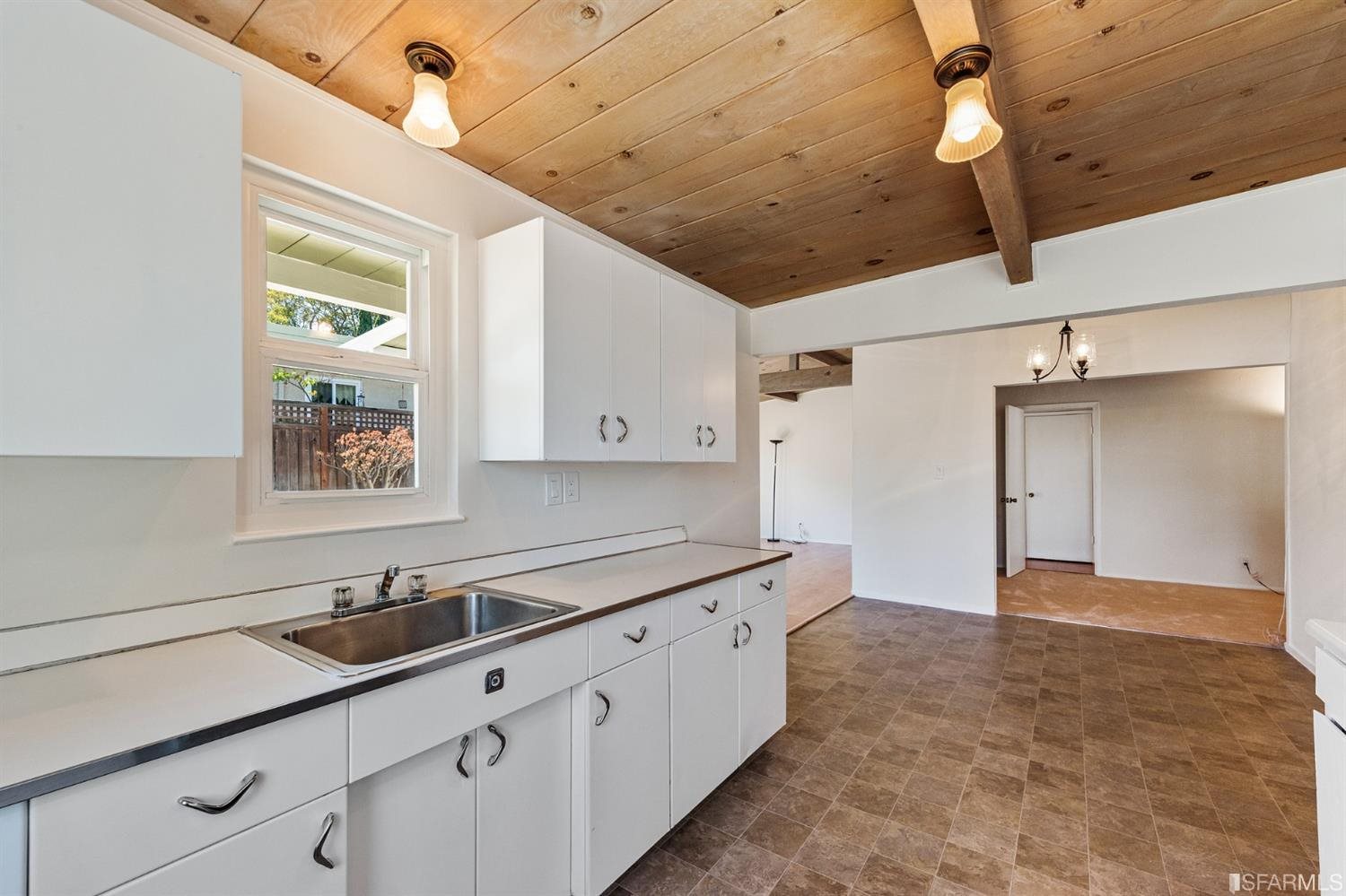 1166 Rising Glen Road Pinole, CA 94564 - Photo 10 of 31 a kitchen with a sink and cabinets