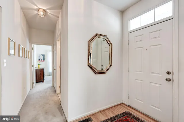 a view of a livingroom with wooden floor and a window