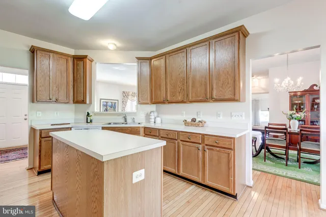 a kitchen with a sink a counter top space and appliances