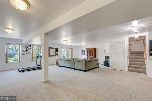 a spacious bedroom with a bed and a cabinets
