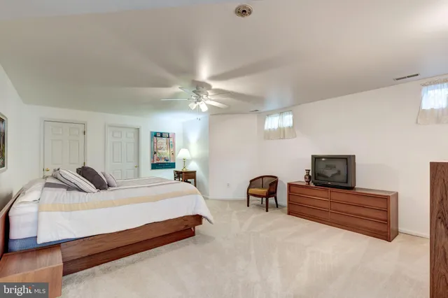 a bedroom with bed and window