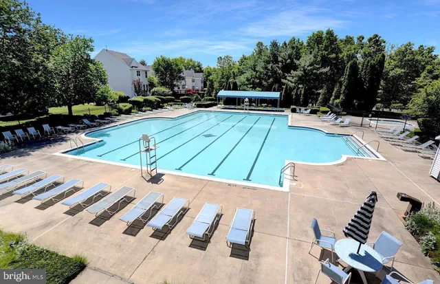 a view of a backyard with sitting area