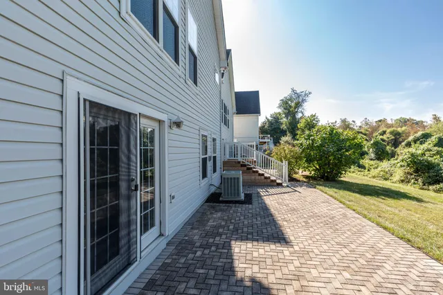 a view of a pathway besides a house