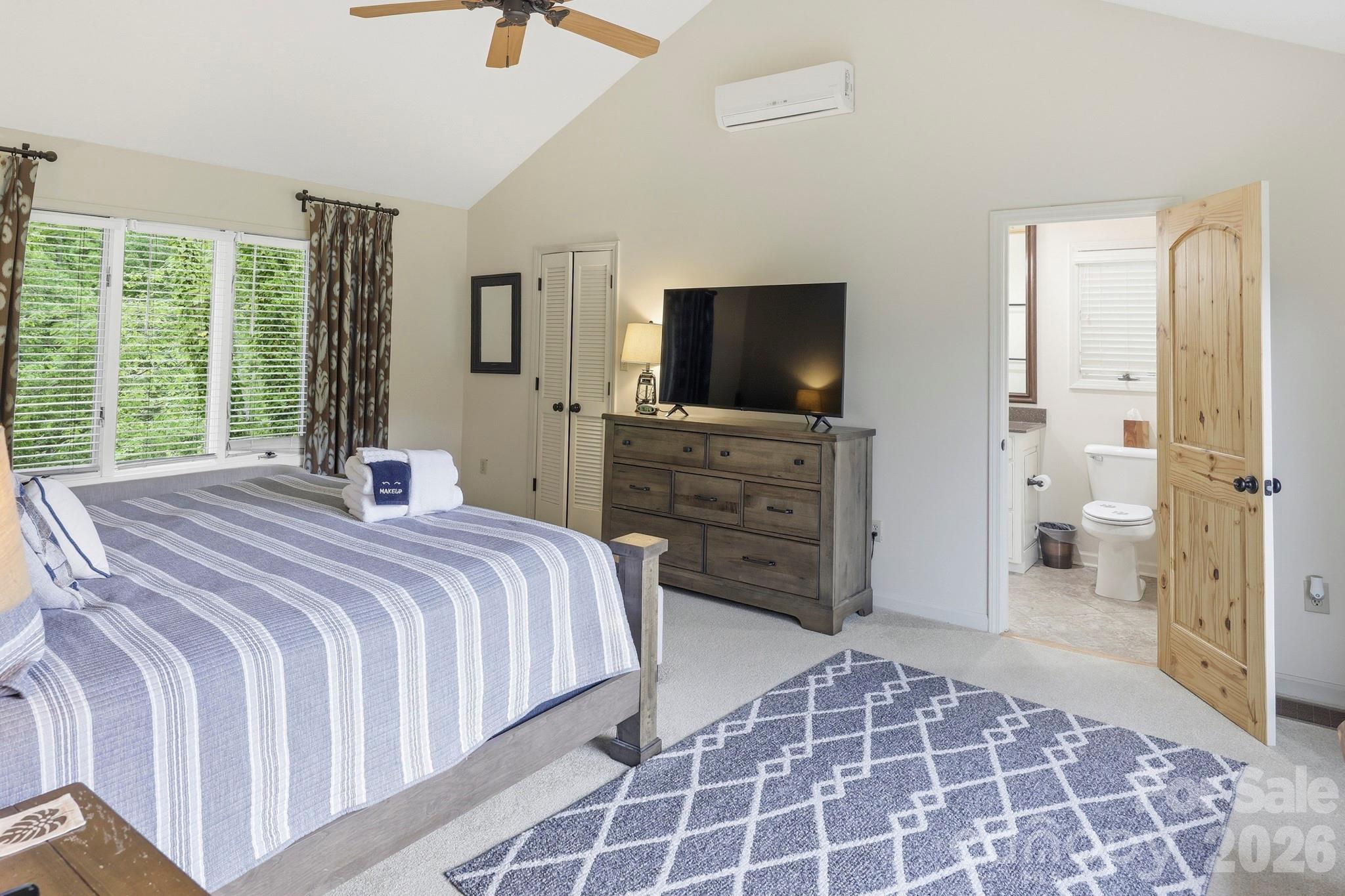 130 Edwards Point Lake Lure, NC 28746 - Photo 16 of 35 a bedroom with a bed and a television