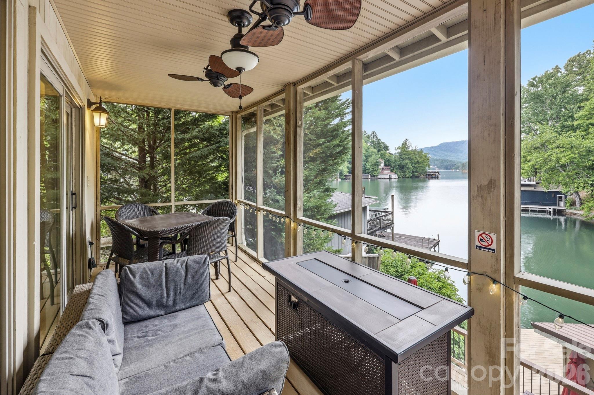130 Edwards Point Lake Lure, NC 28746 - Photo 21 of 35 a balcony with furniture and a potted plant