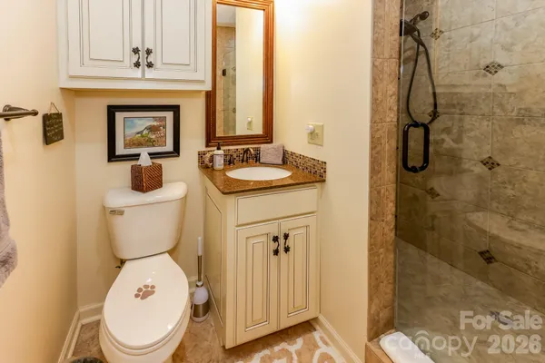 a bathroom with a toilet sink and shower