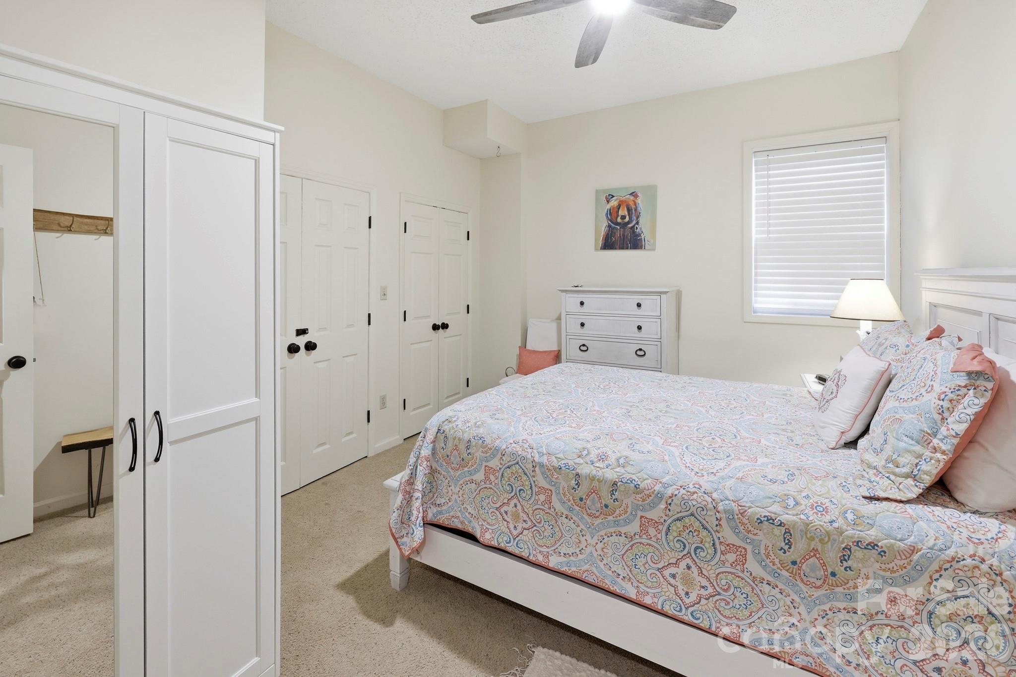 130 Edwards Point Lake Lure, NC 28746 - Photo 24 of 35 a bedroom with a bed and a chandelier