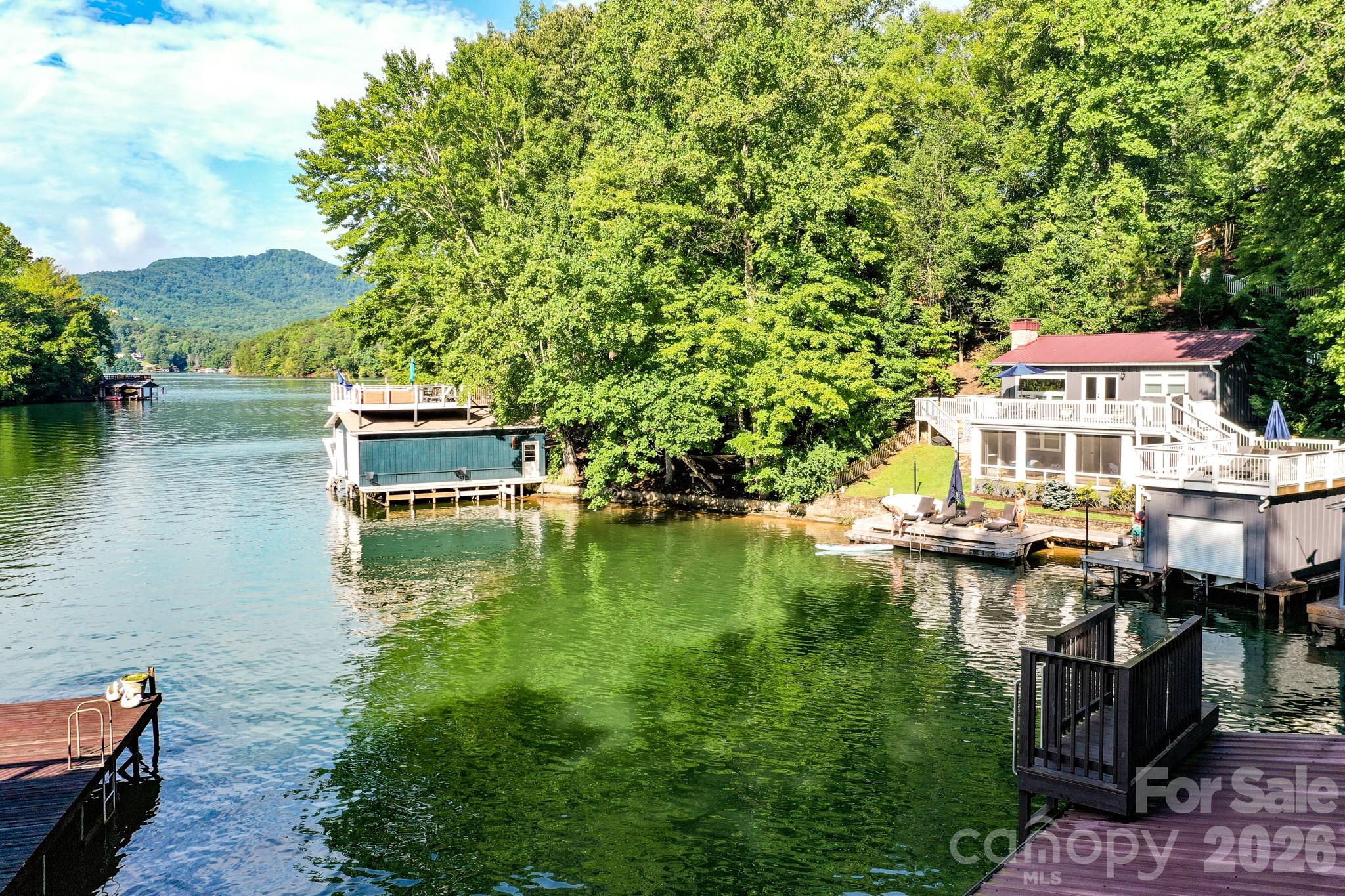 130 Edwards Point Lake Lure, NC 28746 - Photo 26 of 35 a aerial view of a house with swimming pool and lake view