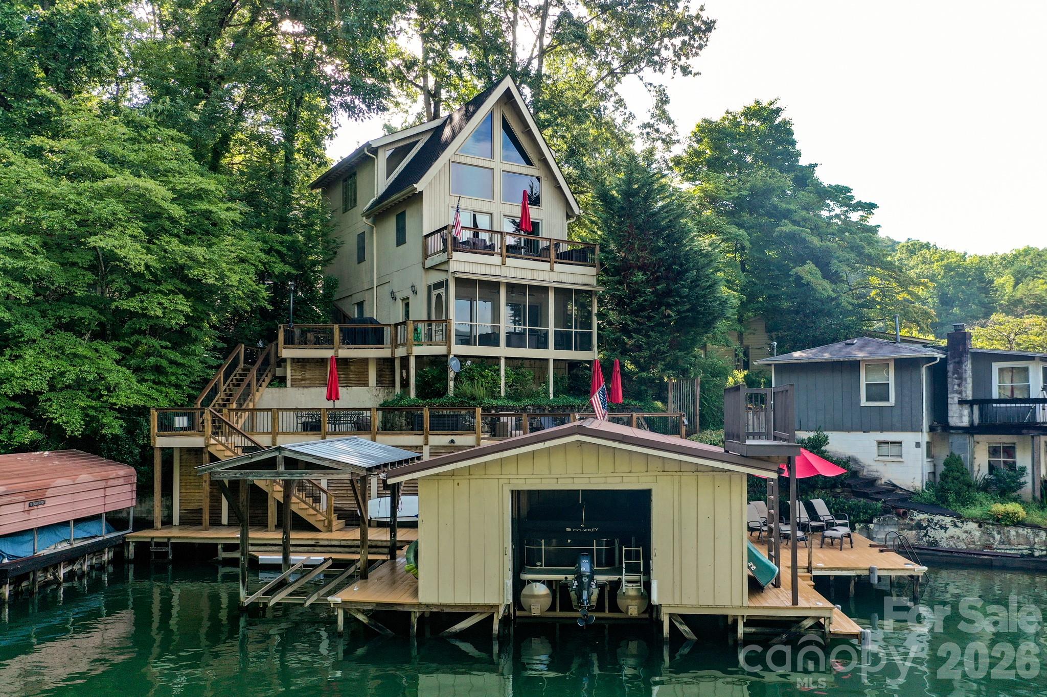 130 Edwards Point Lake Lure, NC 28746 - Photo 27 of 35 a small swimming pool is sitting in front of a house
