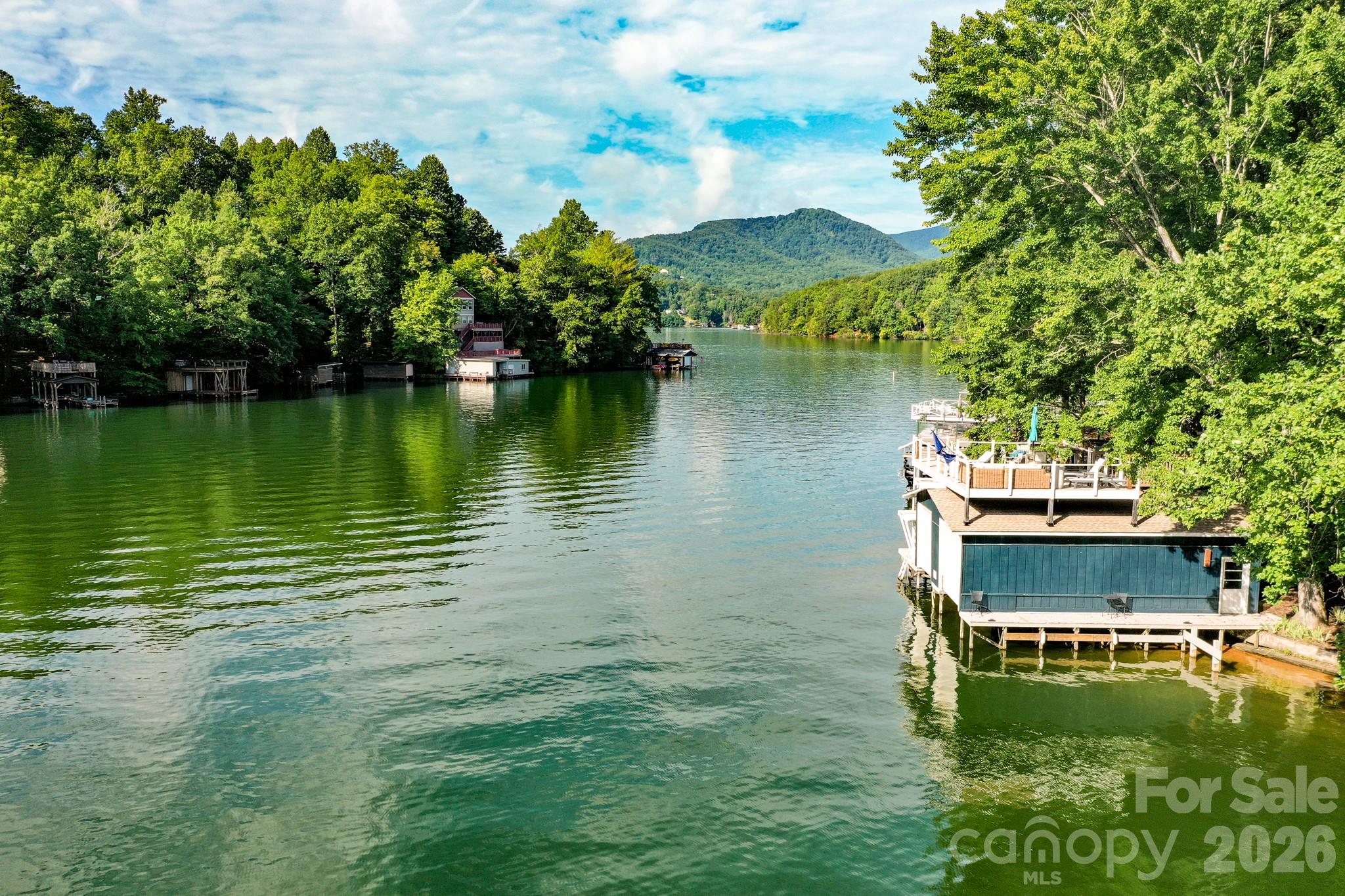 130 Edwards Point Lake Lure, NC 28746 - Photo 35 of 35 a view of a lake with a house in the background