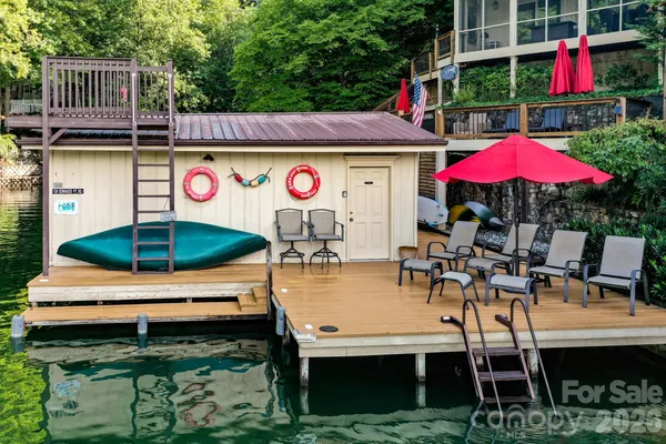 a swimming pool with outdoor seating and yard