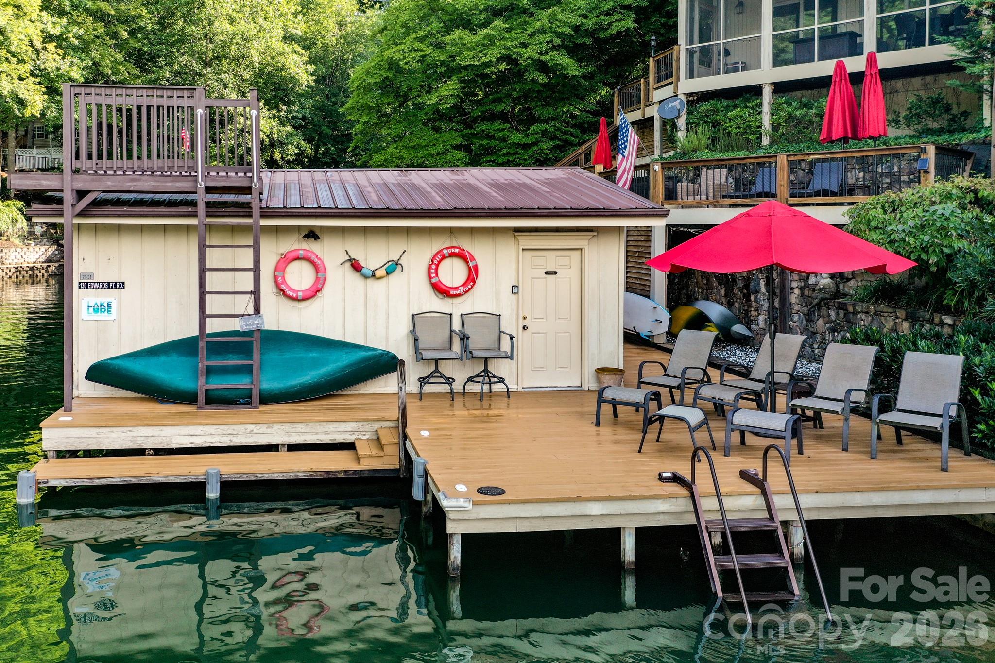130 Edwards Point Lake Lure, NC 28746 - Photo 7 of 35 a swimming pool with outdoor seating and yard