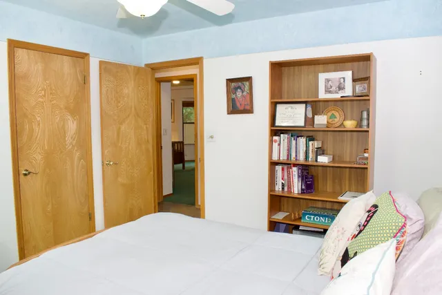 a bedroom with furniture and a window