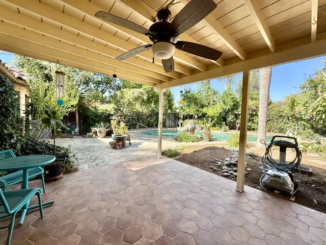 a view of a table and chairs in the garden