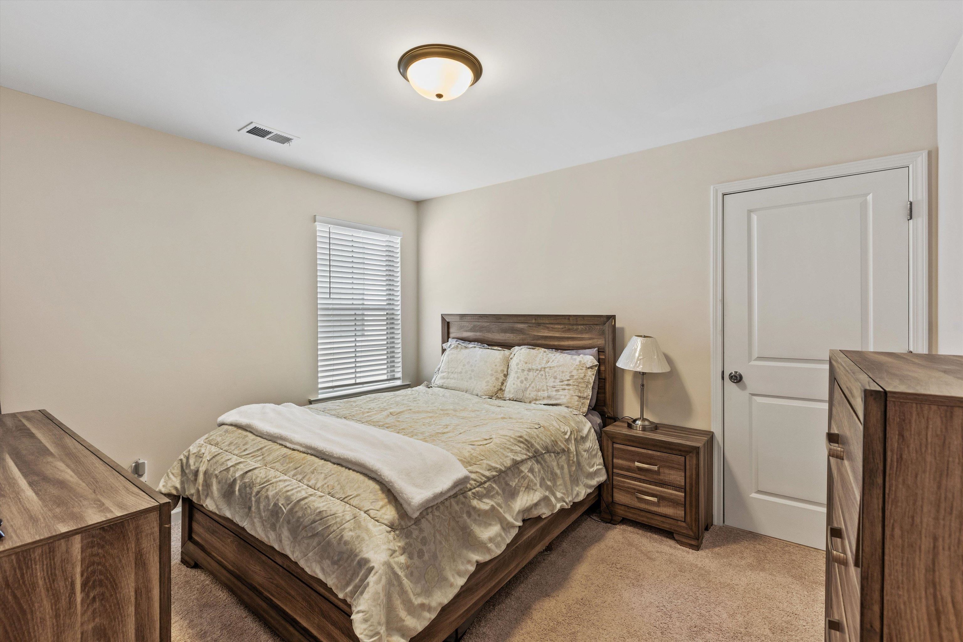 10139 Macon Road Cordova, TN 38018 - Photo 24 of 31 Neutral-toned walls complement the carpeted flooring