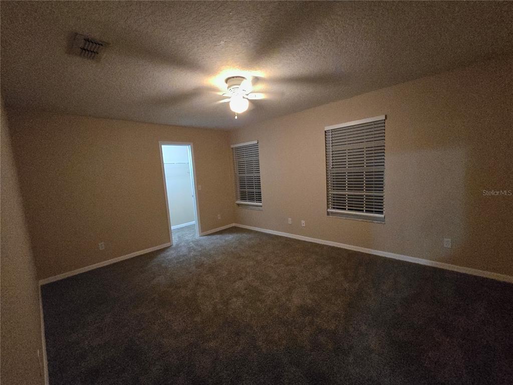 8 Windrose Drive Orlando, FL 32824 - Photo 13 of 23 a view of an empty room with a window