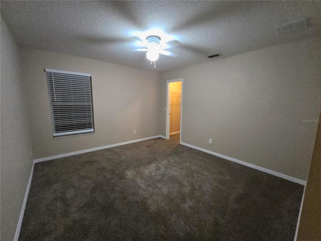 8 Windrose Drive Orlando, FL 32824 - Photo 14 of 23 a view of an empty room with a window